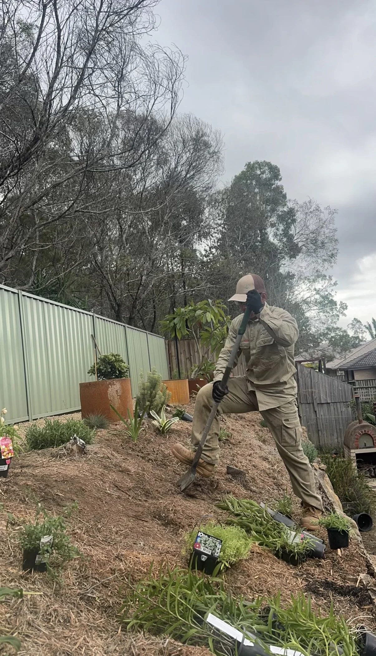 Lou preparing a sloped garden bed for new planting