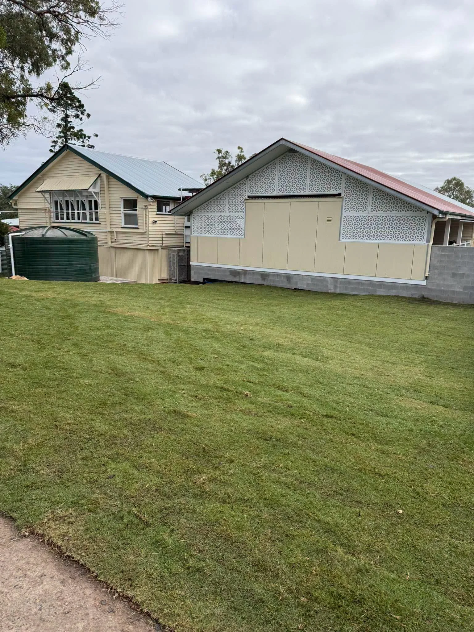Completed turf installation beside a school building at Blenheim State School